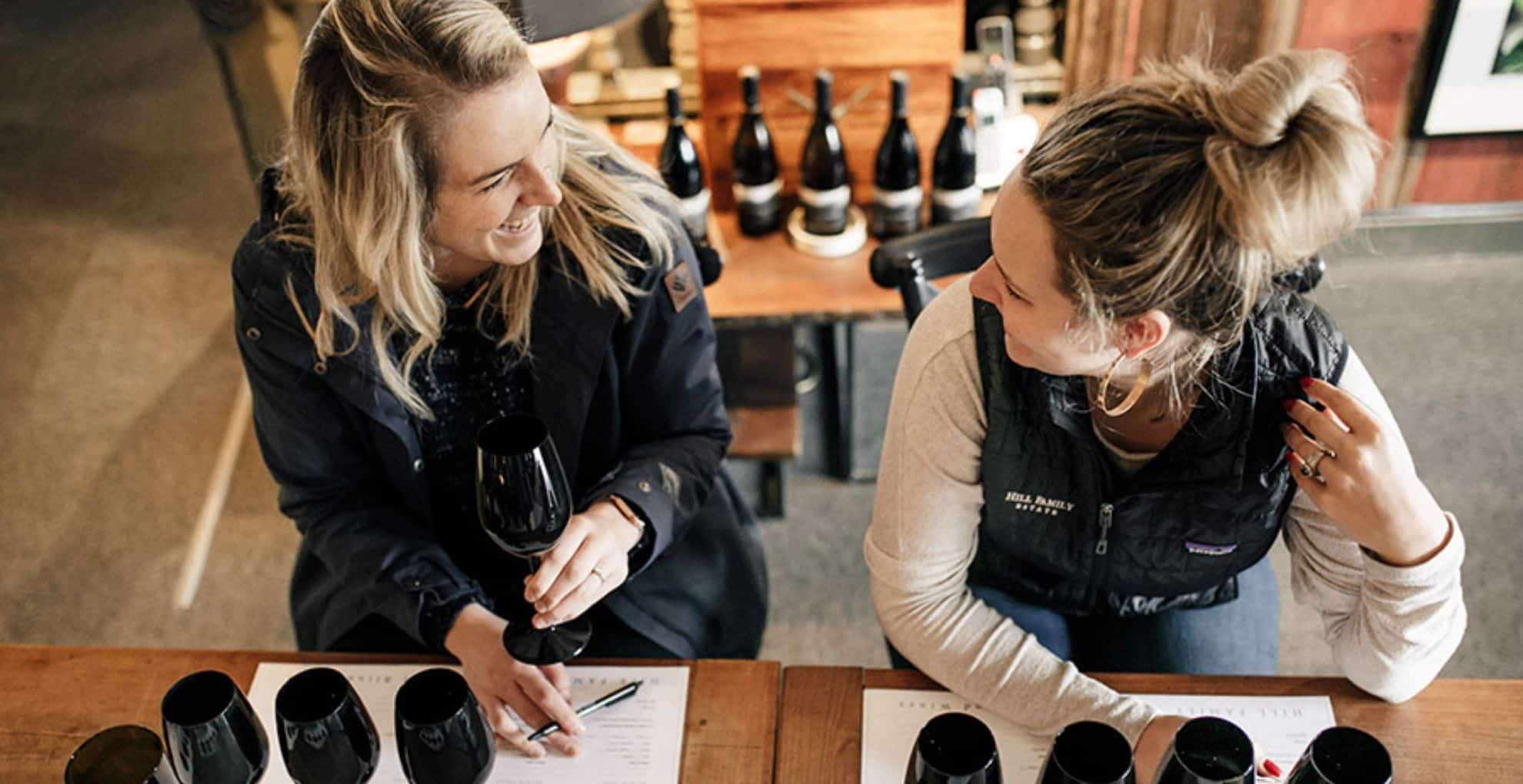 Ladies doing blind tasting at Hill Family