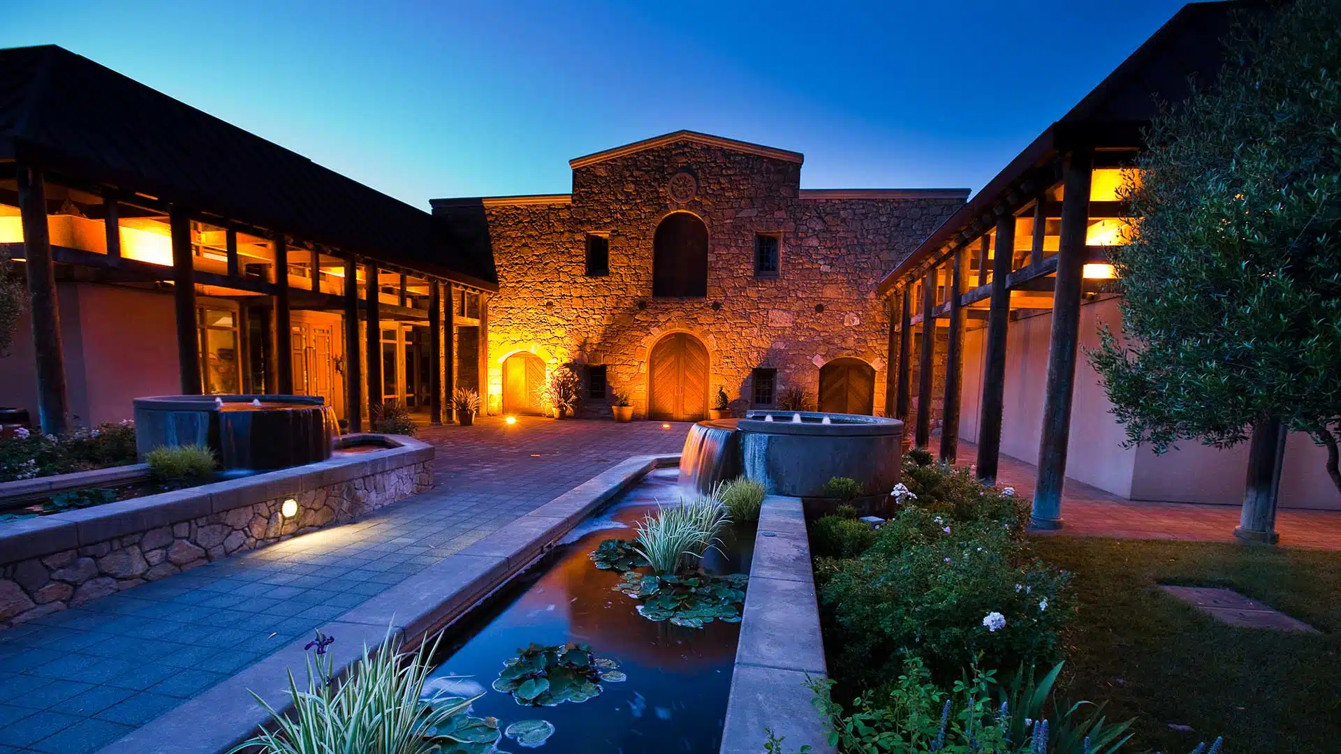 Markham Vineyards tasting terrace overlooking expansive vineyard rows at sunset