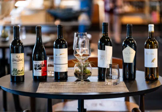 The Yount Room wine selection with six bottles and two glasses