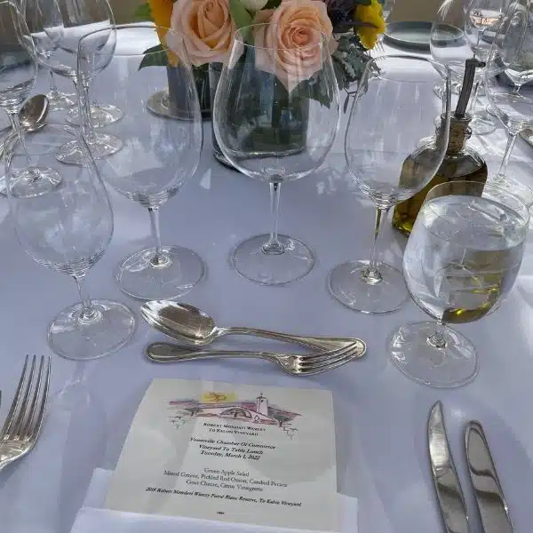 Table setting with menu and flowers