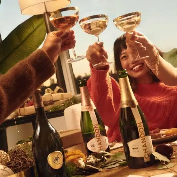 four people cheersing chandon