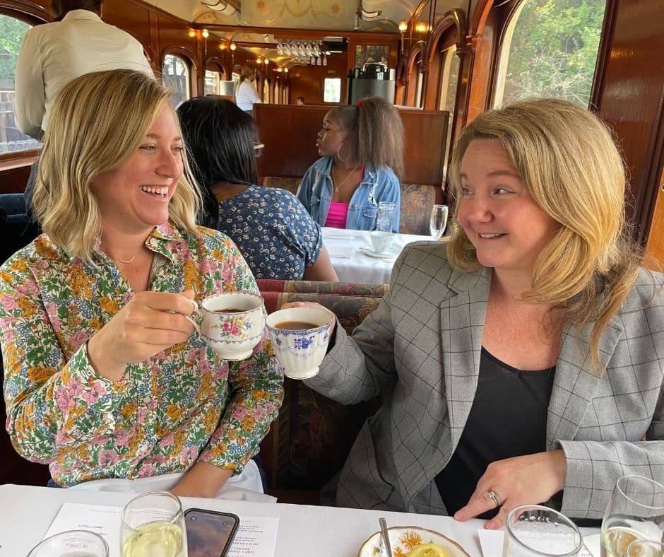 Two blondes drinking tea