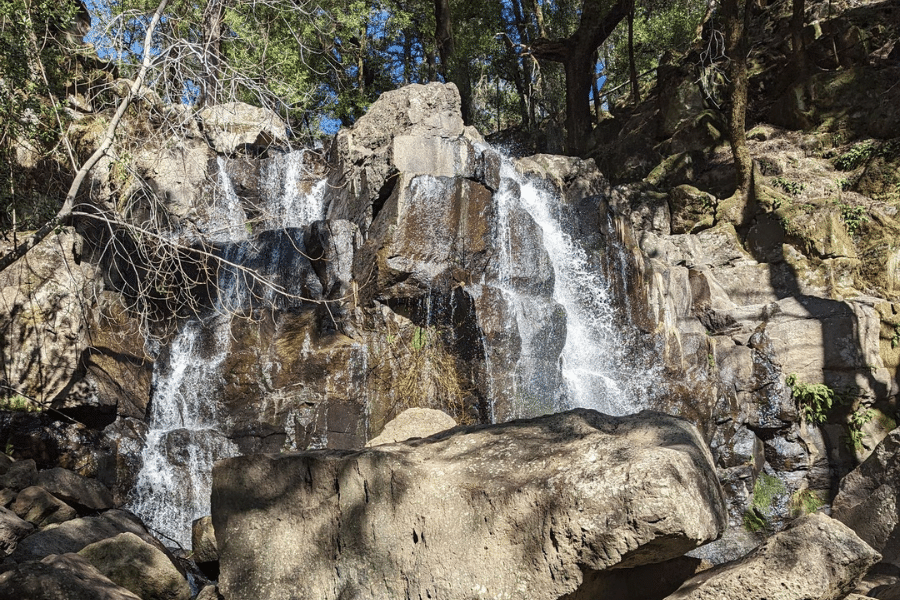 Linda Falls-Featuring a waterfall cascading over rocks