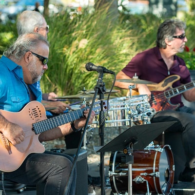 3 guys playing guitars