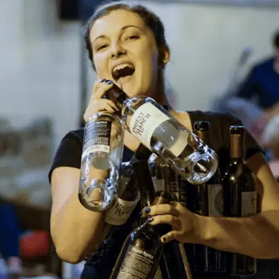 woman carrying wine bottles