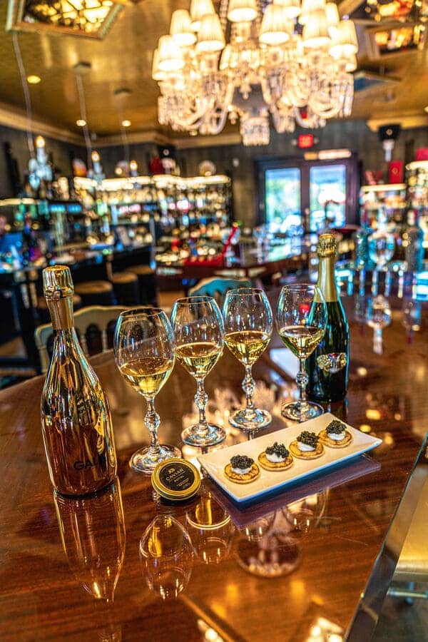Champagne Wishes and Caviar Dreams (JCB) (1) wine and food on bar counter