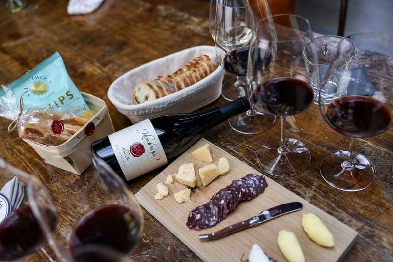 bread and wine arranged on a table