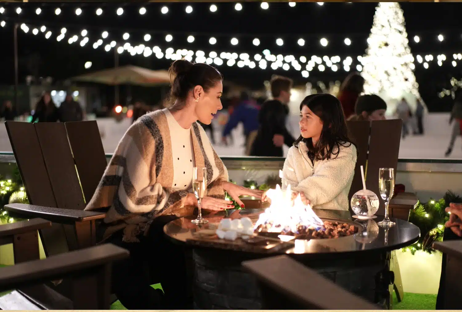 people sitting around a fire pit