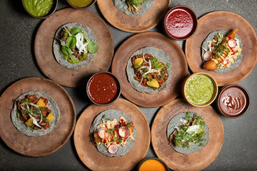 food in bowls and on plates on table