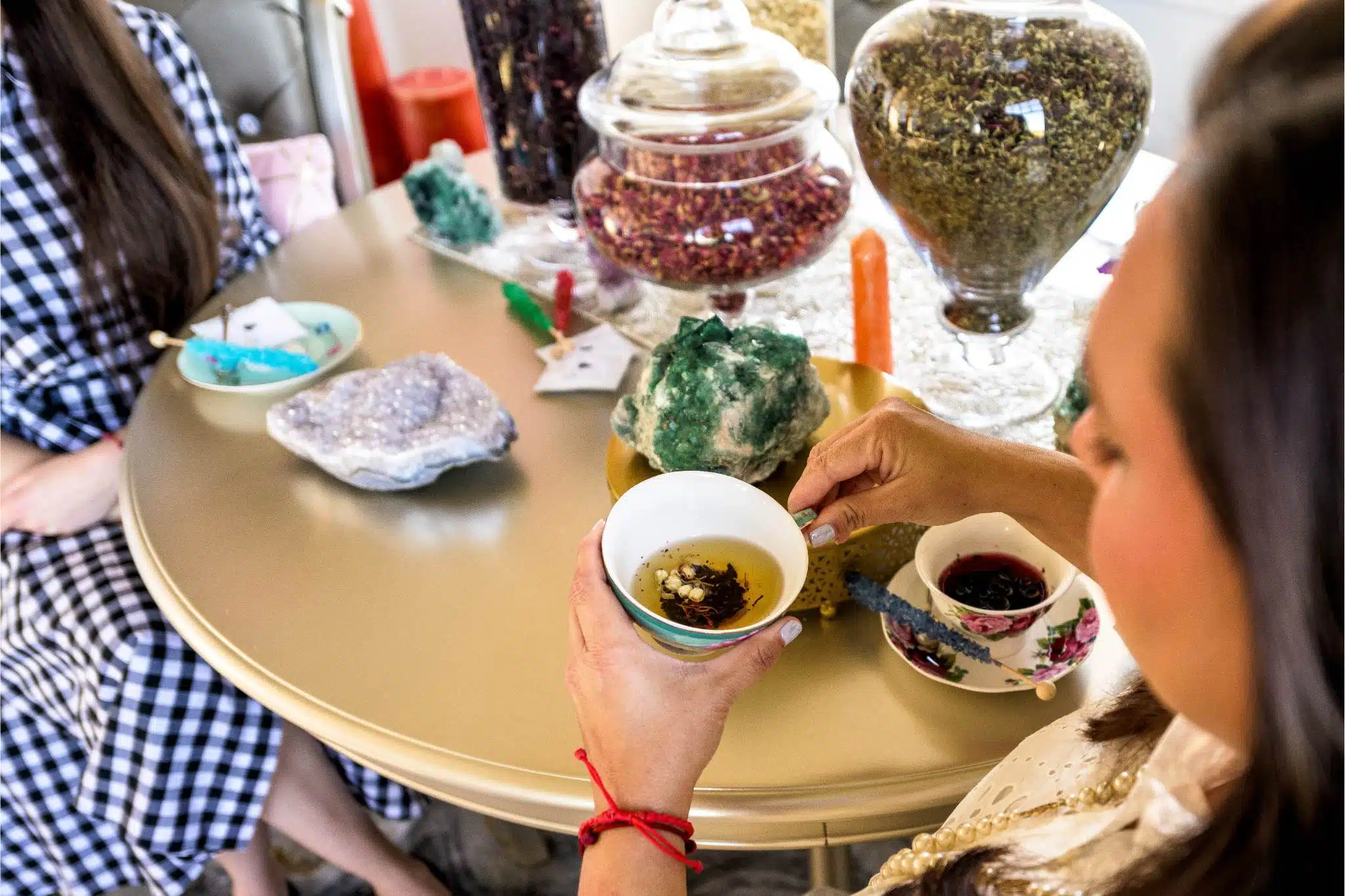 tea leafs in bottom of cup being held