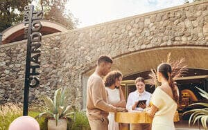 people standing outside front entrance to Chandon Tasting Room