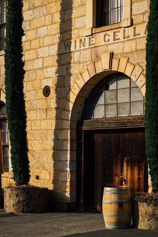 tasting room door with wine barrel in front