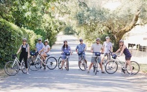 group of people riding bikes outside