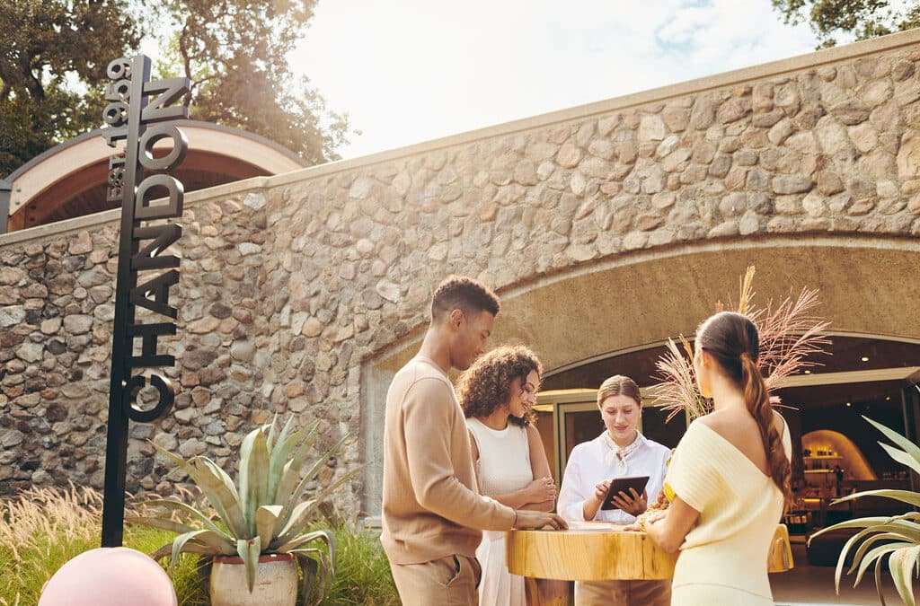 people standing outside front entrance to Chandon Tasting Room