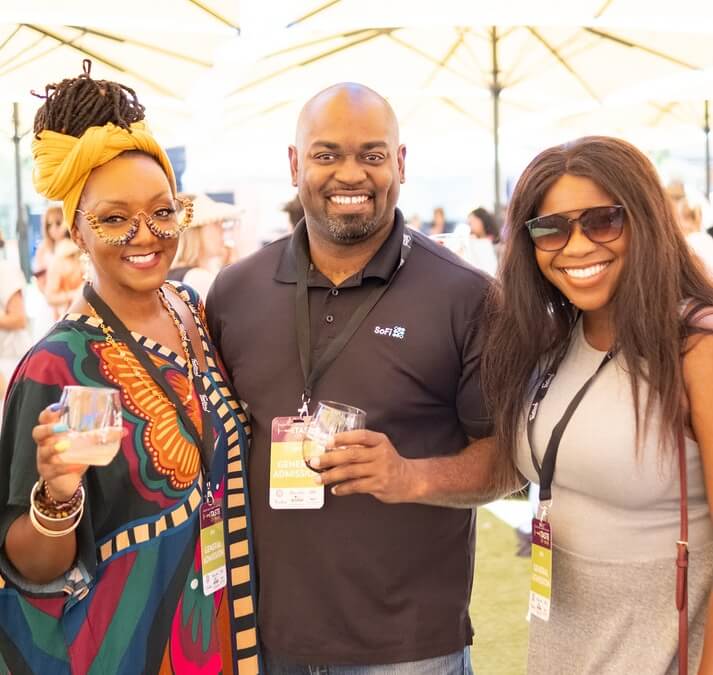 Taste of Napa Meritage copy people smiling at wine tasting event