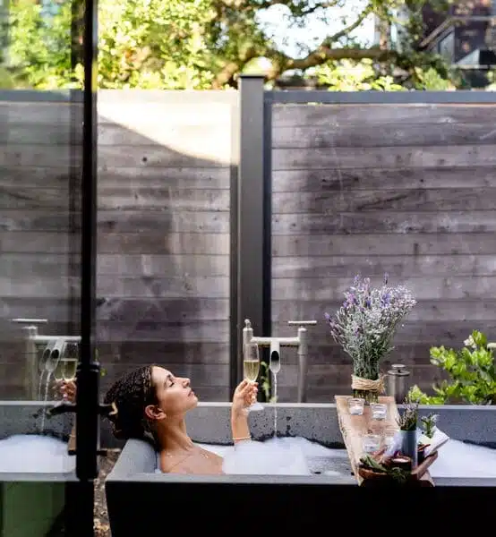 woman sitting in bath outside