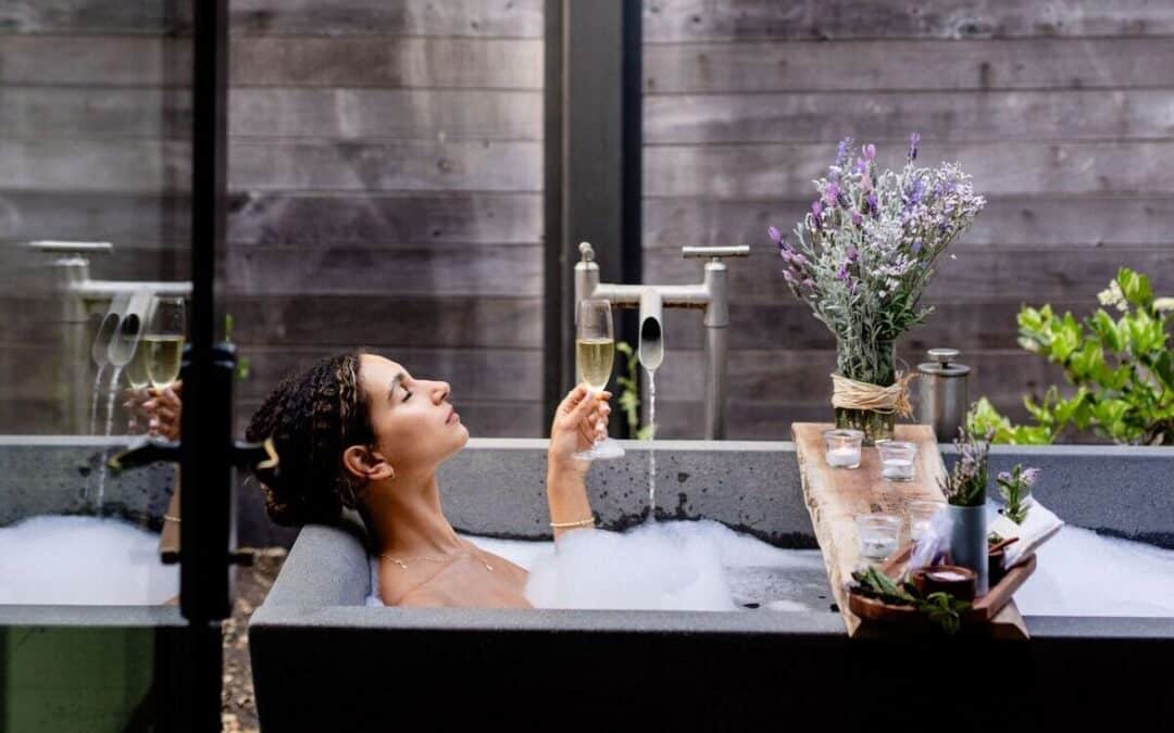 woman sitting in bath outside
