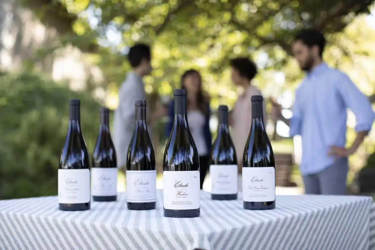 wine bottles sitting on a table outside