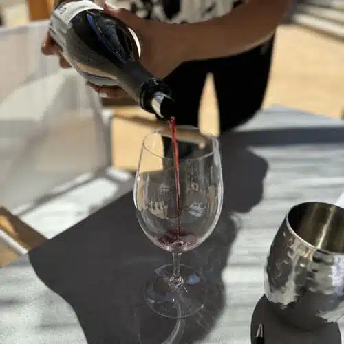 woman pouring wine into wine glass