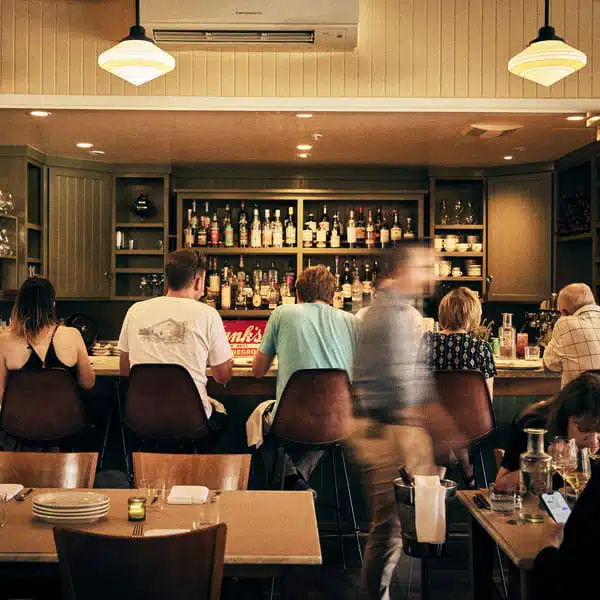 people sitting at bar