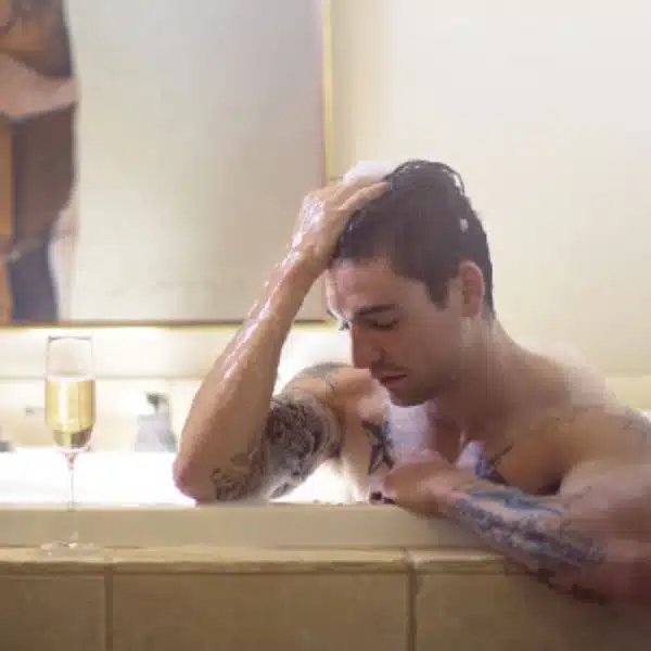 guy soaking in hot tub