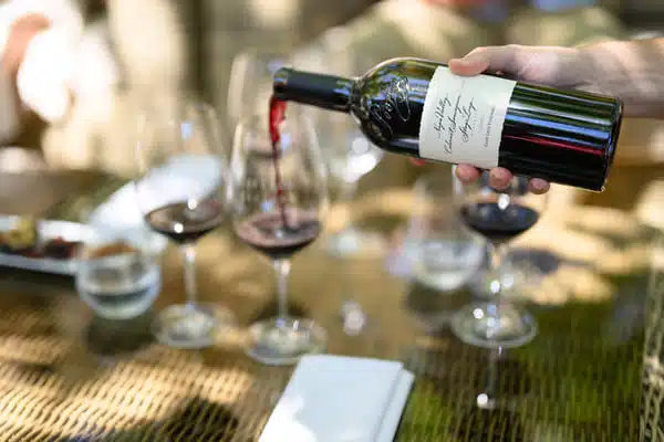 red wine being poured into wine glass