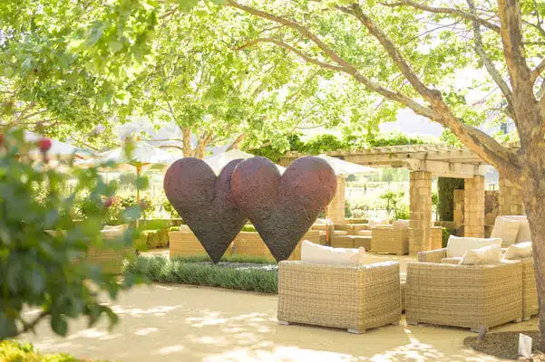 outdoor seating with heart sculptures