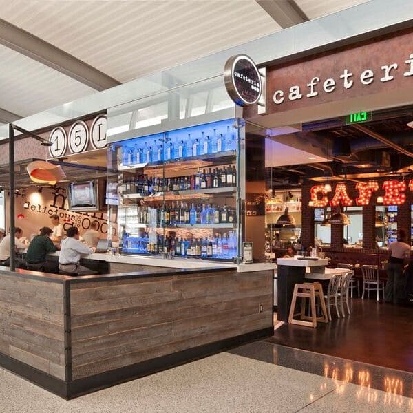 airport cafe with people sitting down eating 