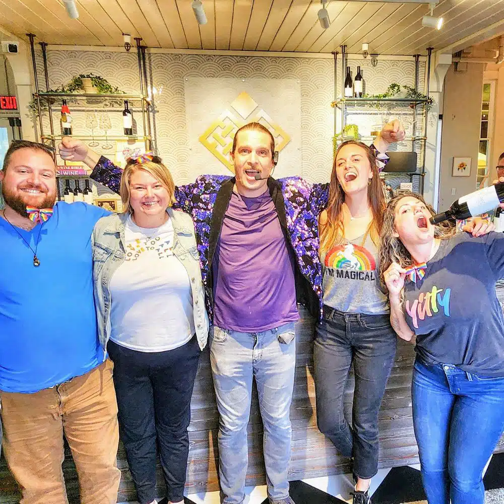 group of friends wine tasting during pride weekend 