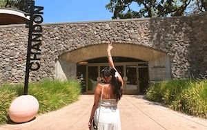 women standing in front of chandon winery