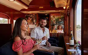 a couple drinking wine on the Napa Valley Wine Train