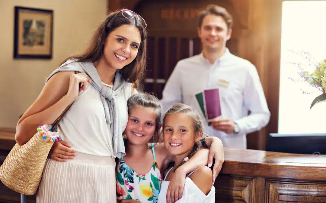 family checking into a hotel